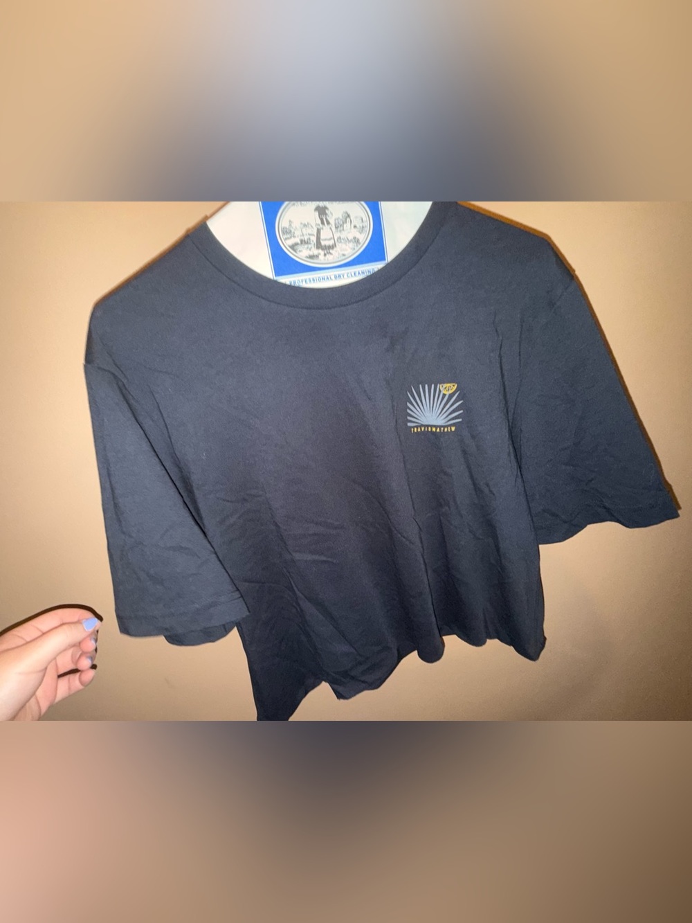 Travis Mathew Navy Crop Tee with Sunburst Pocket Graphic